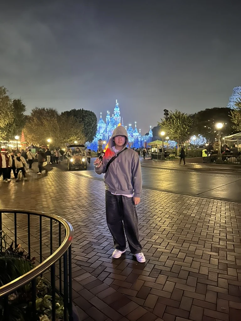 Aiden at a theme park at night
