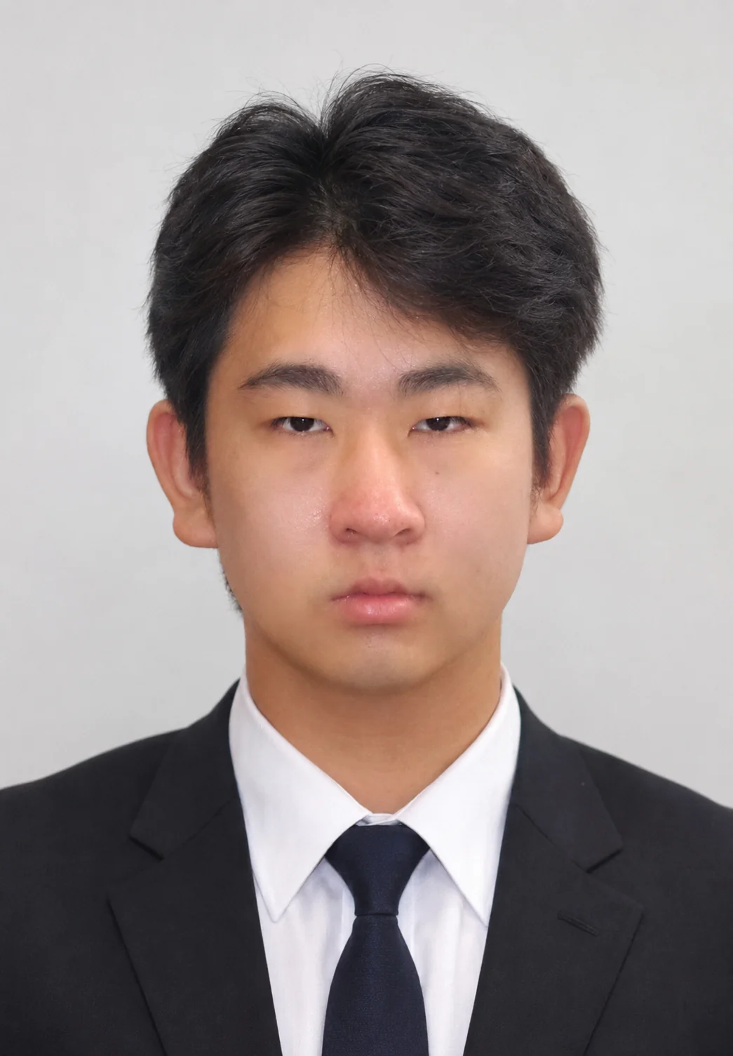 Professional headshot of Aiden Yue