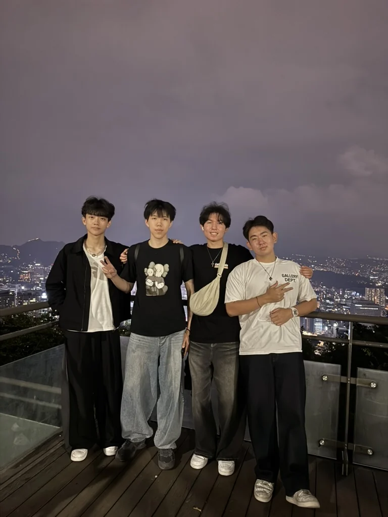 Aiden and friends above the city at night